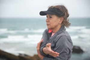 Photo by Kampus Production: https://www.pexels.com/photo/an-elderly-woman-doing-arm-stretching-near-the-water-8638031/