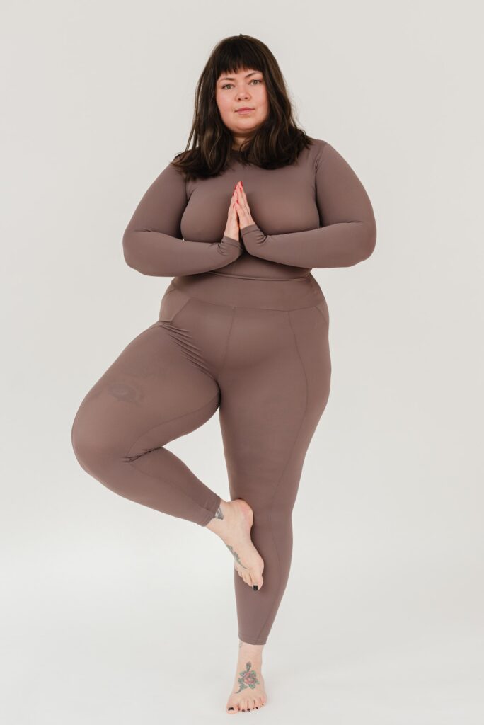 Photo by SHVETS production: https://www.pexels.com/photo/overweight-young-woman-practicing-tree-asana-during-yoga-lesson-6975389/